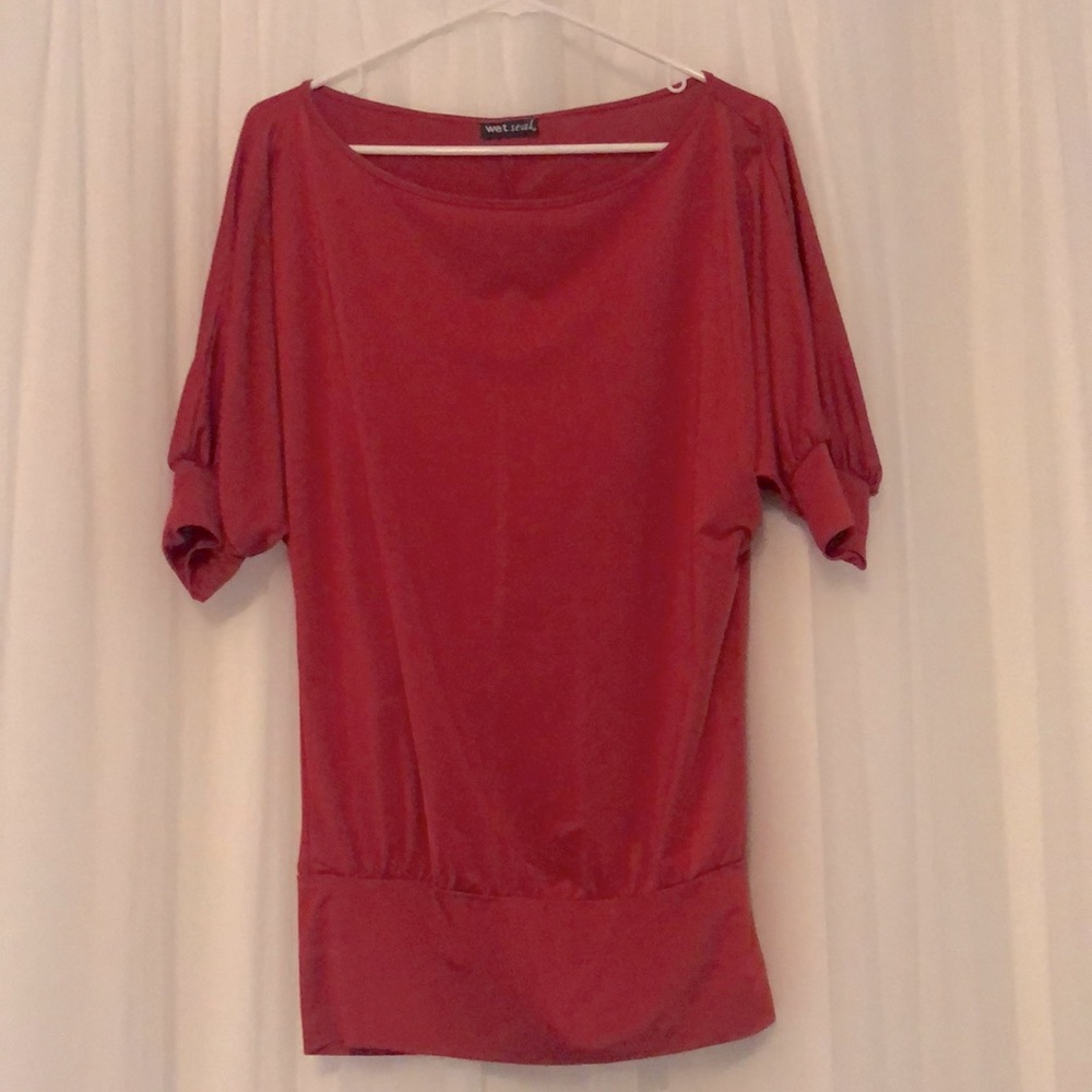 Red dolman sleeve top.